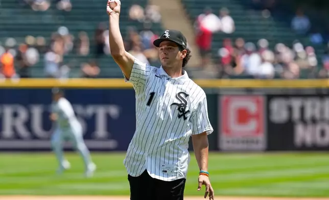 Chicago White Sox's Roch Cholowsky, first round of the 2026 MLB draft (No. 1 overall), throws a ceremonial first pitch before a baseball game between the Athletics and the White Sox in Chicago, Sunday, July 12, 2026. (AP Photo/Nam Y. Huh)