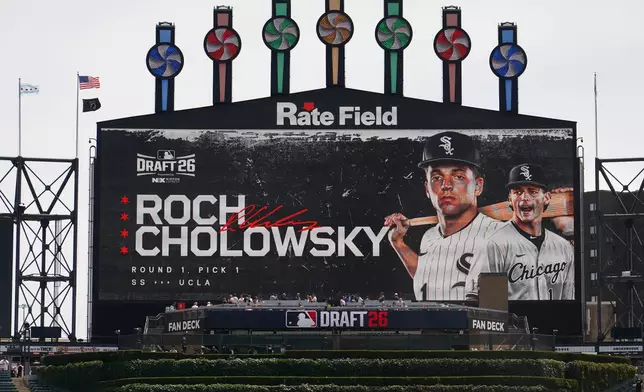 UCLA shortstop Roch Cholowsky goes No. 1 overall to the Chicago White Sox during the 2026 MLB Draft shown on the scoreboard before a baseball game between the Chicago White Sox and the Athletics Saturday, July 11, 2026, in Chicago. (AP Photo/David Banks)