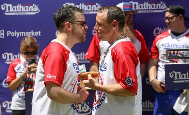 Patrick Bertoletti, left, and Joey Chestnut participate in the Nathan's Famous Fourth of July International Hot Dog Eating Contest weigh-in ceremony at Hudson Yards on Friday, July 3, 2026, in New York. (Photo by Andy Kropa/Invision/AP)