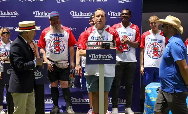 Joey Chestnut stands on a scale at the Nathan's Famous Fourth of July International Hot Dog Eating Contest weigh-in ceremony at Hudson Yards on Friday, July 3, 2026, in New York. (Photo by Andy Kropa/Invision/AP)