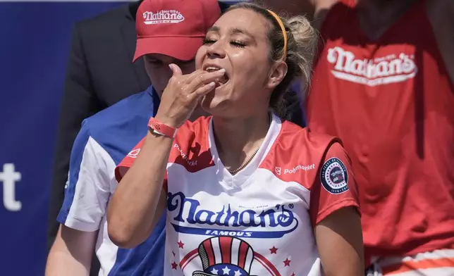 Miki Sudo consume hot dogs during the 2026 Nathan's Famous Fourth of July hot dog eating contest at Coney Island in the Brooklyn borough of New York, Saturday, July 4, 2026. (AP Photo/Anna Connors)