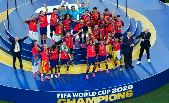 Spain players celebrate after the World Cup final soccer match between Spain and Argentina in East Rutherford, N.J., near New York, Sunday, July 19, 2026. (AP Photo/Yuki Iwamura)