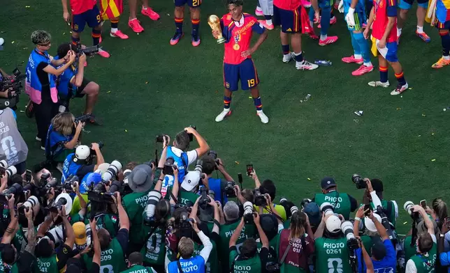 Spain's Lamine Yamal (19) poses for photographs after the World Cup final soccer match between Spain and Argentina in East Rutherford, N.J., near New York, Sunday, July 19, 2026. (AP Photo/Yuki Iwamura)