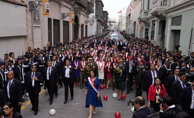 Peru's President Keiko Fujimori walks to the presidential palace after her inauguration in Lima, Peru, Tuesday, July 28, 2026. (AP Photo/Martin Mejia)