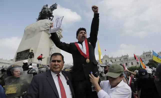 Jesus Perez, of the opposition Together for Peru, party joins opponents of new President Keiko Fujimori during a protest on the day of her inauguration in Lima, Peru, Tuesday, July 28, 2026. (AP Photo/Gerardo Marin)