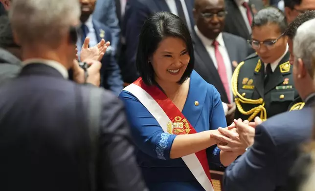 President Keiko Fujimori leaves Congress after taking the oath of office in Lima, Peru, Tuesday, July 28, 2026. (AP Photo/Guadalupe Pardo, Pool)