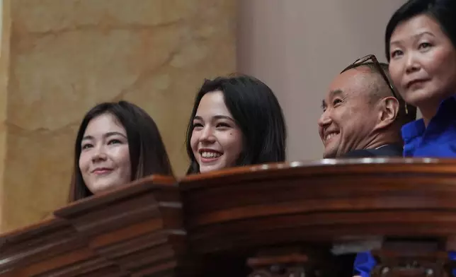 From left, Keiko Fujimori's daughters Kiara Villanella and Kaori Villanella, and her siblings Hiro Fujimori and Sachi Fujimori sit at Congress ahead of her inauguration in Lima, Peru, Tuesday, July 28, 2026. (AP Photo/Guadalupe Pardo, Pool)