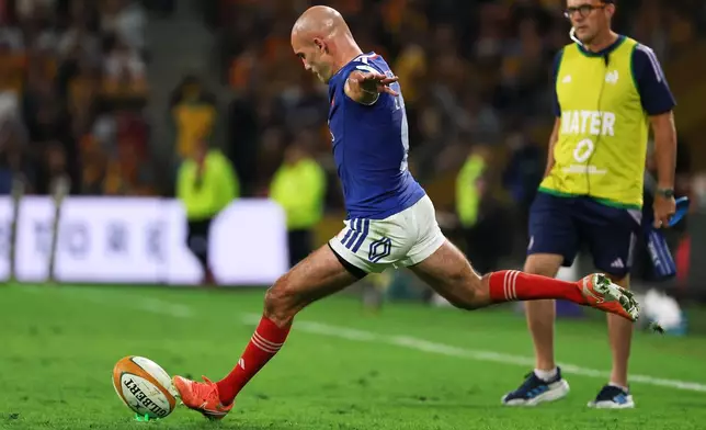France's Maxime Lucu takes a shot at goal during the Nations Championship rugby international between France and Australia in Brisbane, Australia, Saturday, July 11, 2026. (AP Photo/Tertius Pickard)
