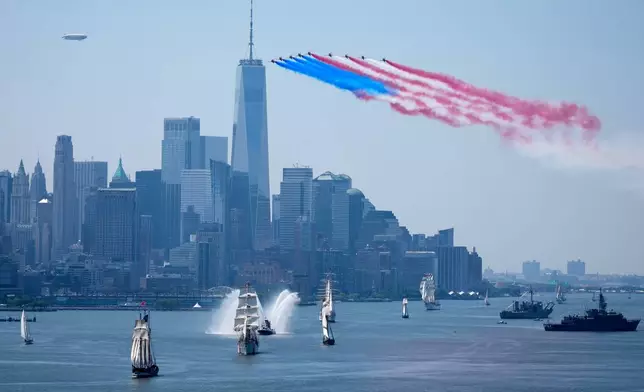 Tall ships parade under flyovers during the International Parade of Sail, part of Sail250, a gathering of tall ships and military ships, Saturday, July 4, 2026, in New York. (AP Photo/Seth Wenig)