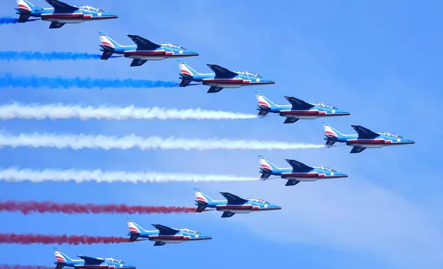 The French Air Force acrobatic squad Patrouille de France perform a flyover during the International Aerial Review, Saturday, July 4, 2026, in New York. (AP Photo/Sydney Schaefer)