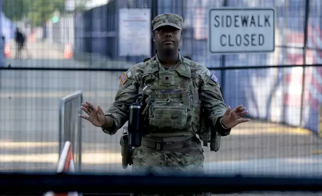 Members of the National Guard patrol near the Washington Monument before Independence Day events honoring the nation's 250th anniversary, Saturday, July 4, 2026, on the National Mall in Washington. (AP Photo/Rahmat Gul)