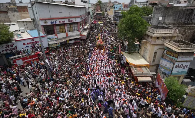 Indian devotees participate in the annual chariot procession of Hindu deity Lord Jagannath, in Ahmedabad, India, Thursday, July 16, 2026. (AP Photo/Ajit Solanki)
