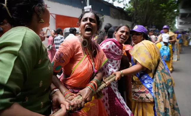 Devotees of the International Society for Krishna Consciousness (ISKCON) pull a rath (chariot) during the annual chariot procession of Hindu deity lord Jagannath in Hyderabad, India, Thursday, July 16, 2026. (AP Photo/Mahesh Kumar A.)