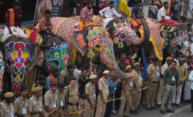 Indian mahouts sit on decorated elephants outside the Lord Jagannath temple on the eve of the annual Rath Yatra or chariot procession of Lord Jagannath in Ahmedabad, India, Wednesday, July 15, 2026. (AP Photo/Ajit Solanki)