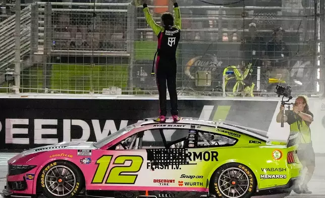 Ryan Blaney celebrates after winning a NASCAR Cup Series auto race, Sunday, July 12, 2026, in Hampton, Ga. (AP Photo/Mike Stewart)