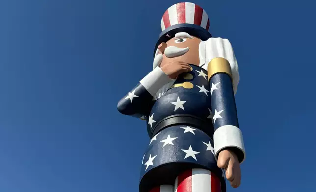 Verne the Patriot, a nutcracker sculpture, is unveiled in Luverne, Minn., Saturday, July 18, 2026. (AP Photo/Sarah Raza)