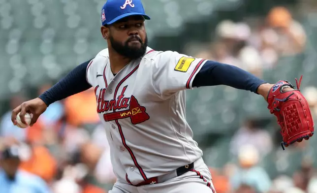 Atlanta Braves pitcher Reynaldo Lopez throws during the first inning of a baseball game against the Baltimore Orioles, Sunday, July 26, 2026, in Baltimore. (AP Photo/Daniel Kucin Jr.)