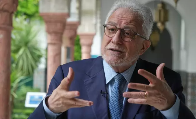 Rector of Paris' Grand Mosque Chems-eddine Hafiz, gestures as he speaks during an interview with the Associated Press, as it celebrates its 100th anniversary in Paris, Friday, July 17, 2026. (AP Photo/Michel Euler)