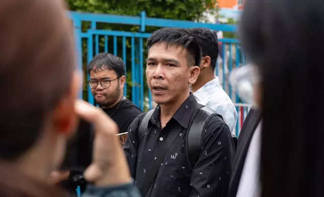 Panithi Tumkaew, a former sailor from the Thailand-flagged ship, the Mayuree Naree, stands outside the Central Labour Court in Bangkok, Thailand on Friday, July 10, 2026. (AP Photo/Anton L. Delgado)