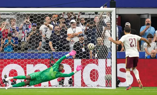 Spain's Mikel Oyarzabal scores the opening goal from the penalty spot past France goalkeeper Mike Maignan during the World Cup semifinal soccer match between France and Spain in Arlington, Texas, near Dallas, Tuesday, July 14, 2026. (AP Photo/Ashley Landis)
