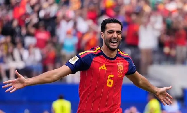 Spain's Mikel Merino (6) celebrates scoring their second goal during the World Cup quarterfinal soccer match between Spain and Belgium in Inglewood, Calif., near Los Angeles, Friday, July 10, 2026. (AP Photo/Mark J. Terrill)