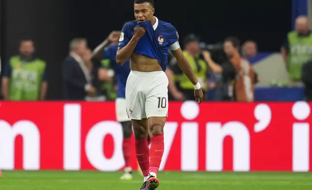 France's Kylian Mbappe (10) reacts after Spain's Mikel Oyarzabal (21) scoring the opening goal from the penalty spot during the World Cup semifinal soccer match between France and Spain in Arlington, Texas, near Dallas, Tuesday, July 14, 2026. (AP Photo/Abbie Parr)