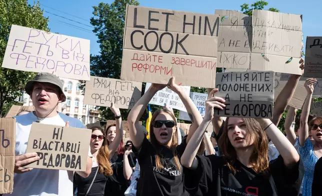 Ukrainians gather to denounce President Volodymyr Zelenskyy's decision to dismiss Defense Minister Mykhailo Fedorov after six months in the post, Kyiv, Ukraine, Thursday, July 16, 2026. (AP Photo/Danylo Antoniuk)
