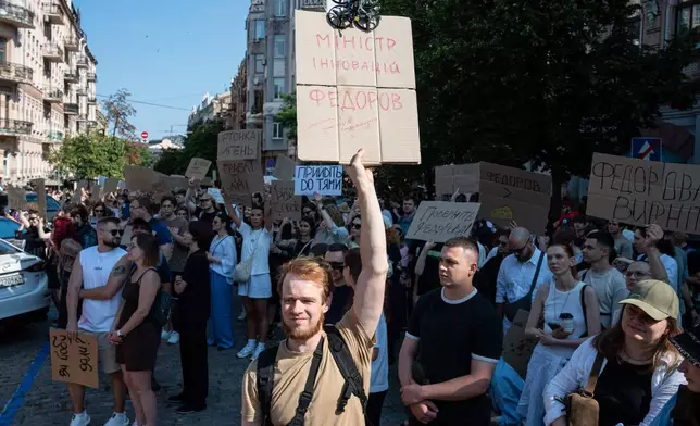 Ukrainians gather to denounce President Volodymyr Zelenskyy's decision to dismiss Defense Minister Mykhailo Fedorov after six months in the post, Kyiv, Ukraine, Thursday, July 16, 2026. Placard reads: Fedorov is a minister of innovation. (AP Photo/Danylo Antoniuk)
