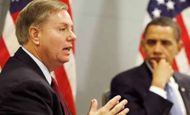 FILE - President-elect Barack Obama looks on as Sen. Lindsey Graham, R-S.C. discusses his recent trip to Afghanistan, Iraq, Kuwait and Pakistan, Jan. 14, 2009, at Obama's transition office in Washington. (AP Photo/Gerald Herbert, File)