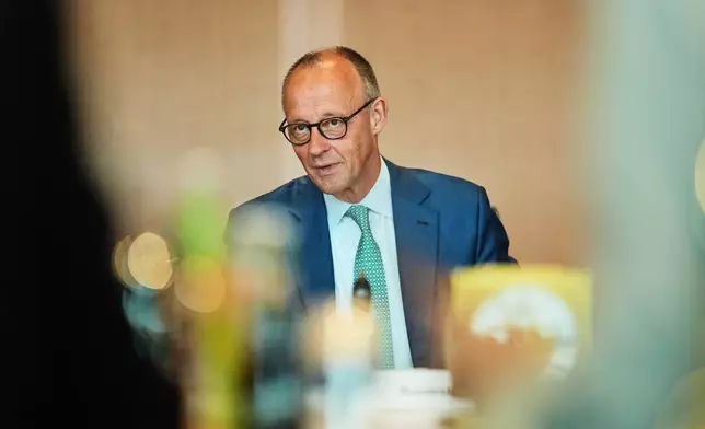 German Chancellor Friedrich Merz arrives for a cabinet meeting at the chancellery in Berlin, Germany, Wednesday, July 22, 2026. (AP Photo/Markus Schreiber)