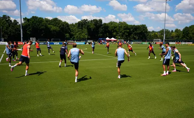 Members of the English national team train for the World Cup soccer tournament Tuesday, July 8, 2025, in Kansas City, Mo. (AP Photo/Charlie Riedel)