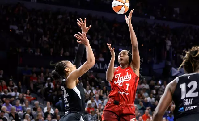 Indiana Fever center-forward Aliyah Boston (7) shoots against Las Vegas Aces center A'ja Wilson (22) during the first half of an WNBA basketball game Sunday, July 12, 2026, in Las Vegas. (Steve Marcus/Las Vegas Sun via AP)