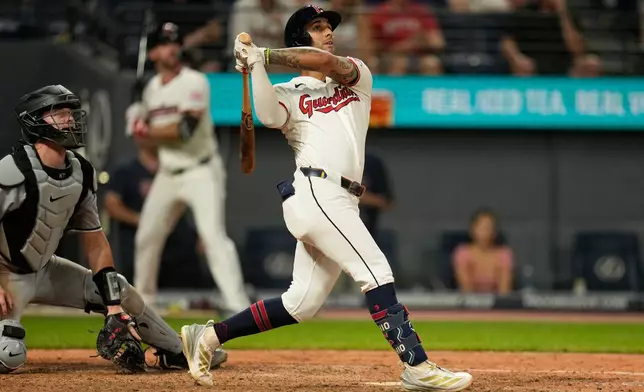 Cleveland Guardians' Brayan Rocchio watches his game winning home run in the ninth inning of a baseball game against the Chicago White Sox in Cleveland, Thursday, July 2, 2026. (AP Photo/Sue Ogrocki)
