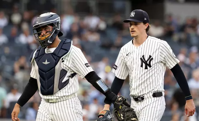 New York Yankees pitcher Max Fried, right, and catcher Ali Sánchez walk to the dugout in the first inning during the second baseball game of a doubleheader against the Pittsburgh Pirates, Wednesday, July 22, 2026, in New York. (AP Photo/Adam Hunger)