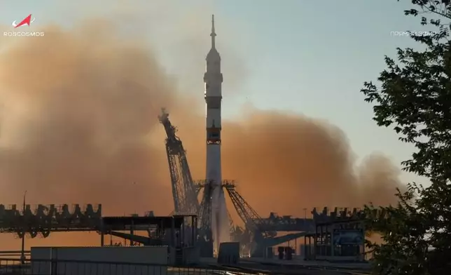 In this photo taken from video released by Roscosmos space corporation, the Soyuz-2.1 rocket booster with Soyuz MS-29 space ship carrying NASA astronaut Anil Menon, Roscosmos cosmonauts Pyotr Dubrov and Anna Kikina, a new crew to the International Space Station, ISS, blasts off in Russian leased Baikonur cosmodrome, Kazakhstan, Tuesday, July 14, 2026. (Roscosmos space corporation, via AP)