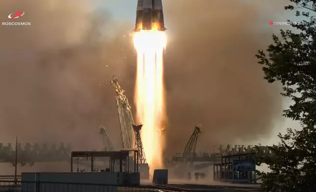 In this photo taken from video released by Roscosmos space corporation, the Soyuz-2.1 rocket booster with Soyuz MS-29 space ship carrying NASA astronaut Anil Menon, Roscosmos cosmonauts Pyotr Dubrov and Anna Kikina, a new crew to the International Space Station, ISS, blasts off in Russian leased Baikonur cosmodrome, Kazakhstan, Tuesday, July 14, 2026. (Roscosmos space corporation, via AP)
