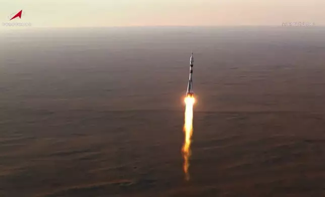 In this photo taken from video released by Roscosmos space corporation, the Soyuz-2.1 rocket booster with Soyuz MS-29 space ship carrying NASA astronaut Anil Menon, Roscosmos cosmonauts Pyotr Dubrov and Anna Kikina, a new crew to the International Space Station, ISS, blasts off in Russian leased Baikonur cosmodrome, Kazakhstan, Tuesday, July 14, 2026. (Roscosmos space corporation, via AP)
