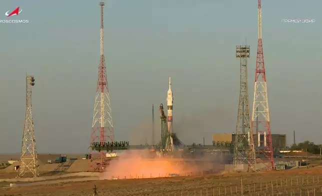 In this photo taken from video released by Roscosmos space corporation, the Soyuz-2.1 rocket booster with Soyuz MS-29 space ship carrying NASA astronaut Anil Menon, Roscosmos cosmonauts Pyotr Dubrov and Anna Kikina, a new crew to the International Space Station, ISS, blasts off in Russian leased Baikonur cosmodrome, Kazakhstan, Tuesday, July 14, 2026. (Roscosmos space corporation, via AP)