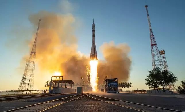 A Soyuz rocket launches to the International Space Station carrying Expedition 75 crewmembers, NASA astronaut Anil Menon, Roscosmos cosmonauts Pyotr Dubrov and Anna Kikina, at the Baikonur Cosmodrome in Kazakhstan on Tuesday, July 14, 2026. (Bill Ingalls/NASA via AP)