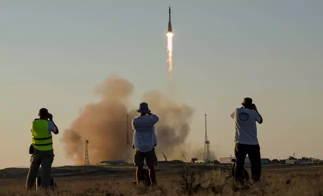 The Soyuz rocket launches to the International Space Station with Expedition 75 crew members: NASA astronaut Anil Menon, Roscosmos cosmonauts Pyotr Dubrov, and Anna Kikina onboard, Tuesday, July 14, 2026 at the Baikonur Cosmodrome in Kazakhstan. (Bill Ingalls/NASA via AP)
