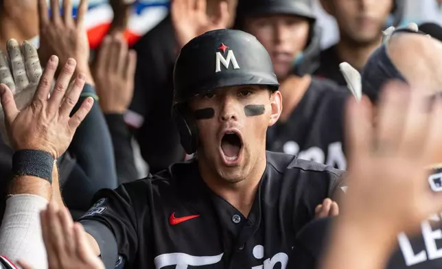 Minnesota Twins' Brooks Lee reacts after hitting a three-run home run off Cleveland Guardians starting pitcher Slade Cecconi during the fourth inning of a baseball game, Wednesday, July 22, 2026, in Cleveland. (AP Photo/Phil Long)