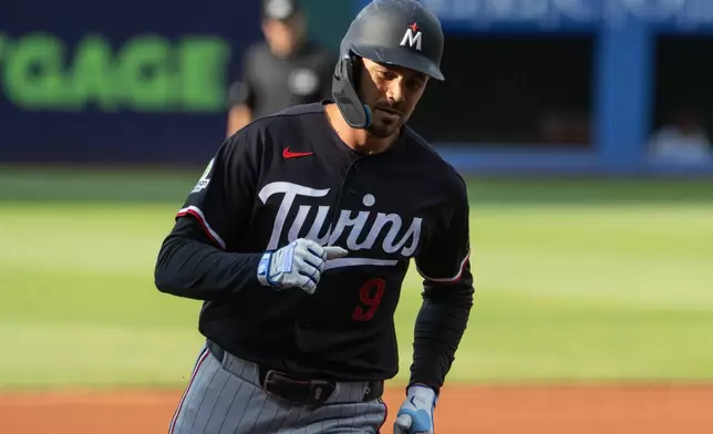 Minnesota Twins' Trevor Larnach rounds the bases after hitting a solo home run off Cleveland Guardians starting pitcher Slade Cecconi during the first inning of a baseball game, Wednesday, July 22, 2026, in Cleveland. (AP Photo/Phil Long)