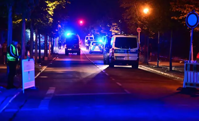 Police officers are on the scene following the cancellation of Christopher Street Day in Berlin, on Saturday, July 25, 2026. (Fabian Sommer/dpa/dpa via AP)