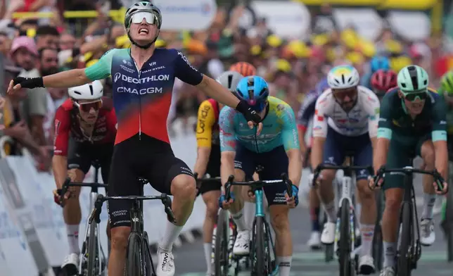 Netherland's Olav Kooij celebrates as he crosses the finish line to win the fifth stage of the Tour de France cycling race with start in Lannemezan and finish in Pau, France, Wednesday, July 8, 2026. (AP Photo/Thibault Camus)