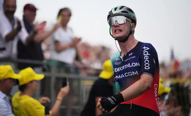 Netherland's Olav Kooij celebrates as he crosses the finish line to win the fifth stage of the Tour de France cycling race with start in Lannemezan and finish in Pau, France, Wednesday, July 8, 2026. (AP Photo/Mosa'ab Elshamy)