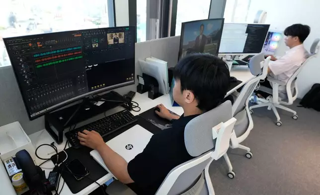 Employees at Seoul-based tech firm Vaice work at their office, South Korea, Friday, June 12, 2026. (AP Photo/Ahn Young-joon)