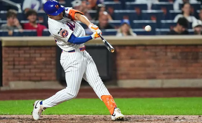 New York Mets' Tyrone Taylor hits a three-run home run during the seventh inning of a baseball game against the Atlanta Braves Monday, July 27, 2026, in New York. (AP Photo/Frank Franklin II)
