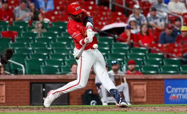 St. Louis Cardinals' Jordan Walker hits an RBI single during the sixth inning against the Atlanta Braves Friday, July 10, 2026, in St. Louis. (AP Photo/Scott Kane)