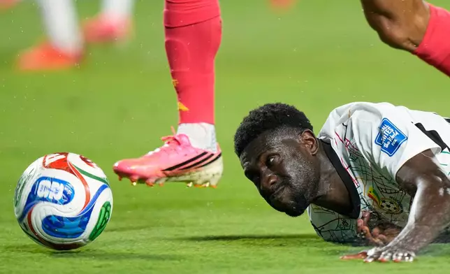 Ghana's Derrick Luckassen (23) falls during the World Cup round of 32 soccer match between Colombia and Ghana in Kansas City, Mo., Friday, July 3, 2026. (AP Photo/Charlie Riedel)