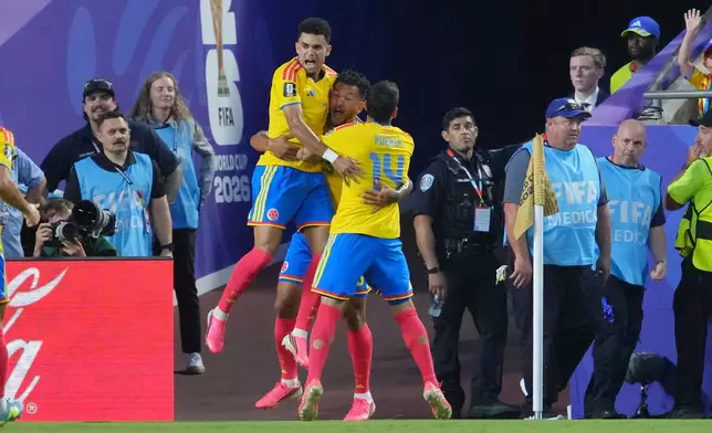 Columbia players celebrate a Jhon Arias goal against Ghana during the World Cup round of 32 soccer match in Kansas City, Mo., Friday, July 3, 2026. (AP Photo/Ed Zurga)